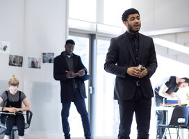 Actors rehearsing in a sunny studio