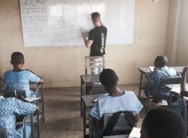 Volunteer given lesson to his students