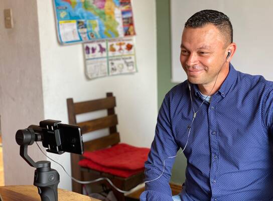A Spanish Professor at Tico Lingo teaches an online Spanish class to a student in Canada