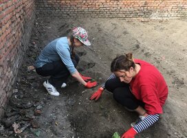 Volunteers in Nepal planting vegetable garden