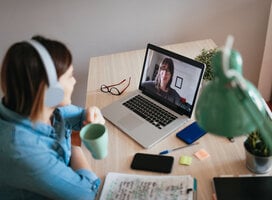 Young woman learning on laptop