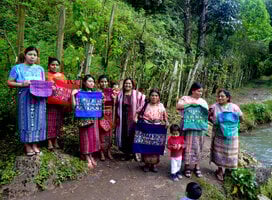 Weavers showing off their hand-woven pillows