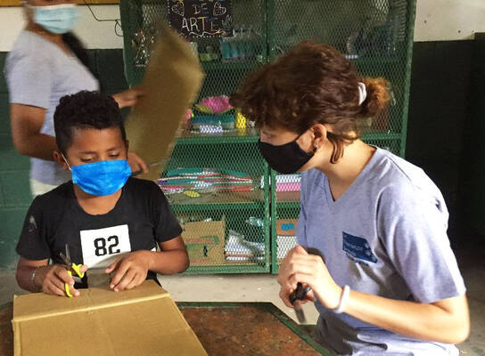 An international volunteer teaching art
