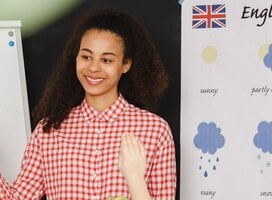 Female teaching English language to students