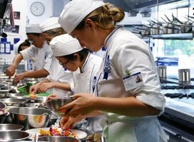 Students in the kitchen during Cuisine Diploma program at Le Cordon Bleu