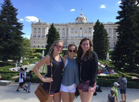 3 Horizons Abroad teen Spanish immersion students smiling in front of Madrid's Royal Palace