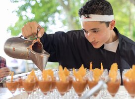a student pours out something delicious in our culinary class