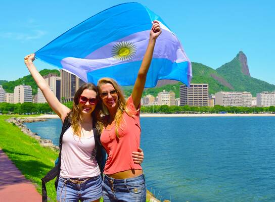 Women holding Argentina's flag