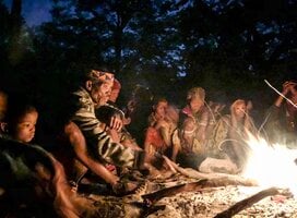 San Bushmen sitting around the fire at a Healing dance event