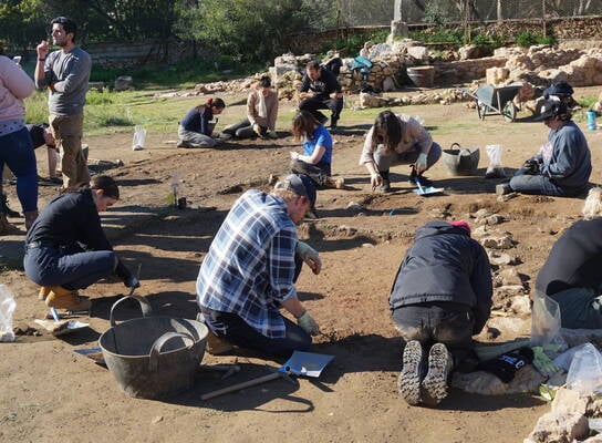 Students digging at excavation site