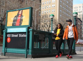 Two NYLC students walk near an NYC subway station