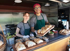 two students making empanadas