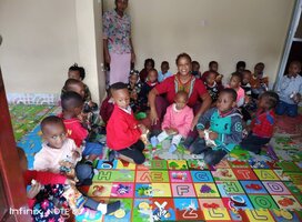 Caretaker with children at Childcare center.