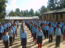Rural school kids gathered out for school assembly
