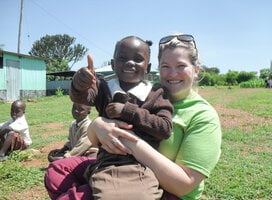 volunteer with a young girl