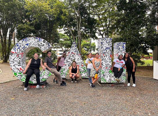 CET Colombia study abroad students pose in front of giant letters spelling "Cali"