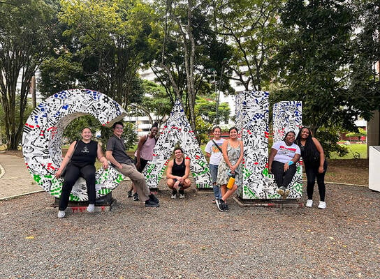 CET Colombia study abroad students pose in front of giant letters spelling "Cali"