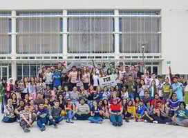 Group shot of FIU ELI students holding their country's flags.