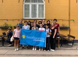 Group of students with Smithsonian flag