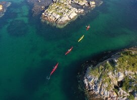 Kayakers padling thrugh archipelago, drone picture