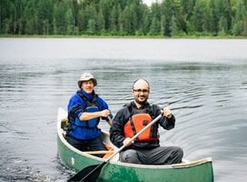 Two men canoeing in the Outaouais, Québec, Canada.