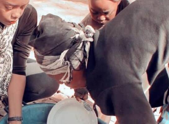Washing the dishes at feeding site