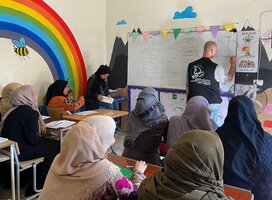 Teacher teaching students ESL