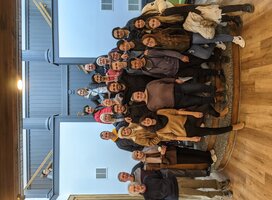 Students pose for a photo with the WESLI Teacher Training Program graduates