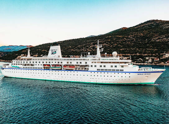 MV World Odyssey sailing into port