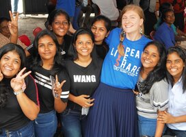 Teacher socialising with students at an event