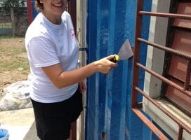 Volunteers doing building maintenance