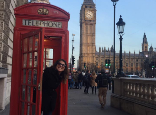 Intern in phonebooth in front of Big Ben 