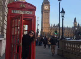 Intern in phonebooth in front of Big Ben 