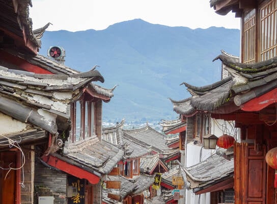 red buildings and roofs with mountain
