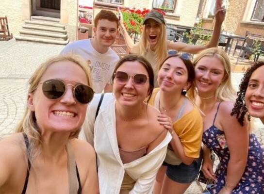 Students posing on street in Prague