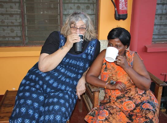 Volunteer enjoying tea with Headmistress
