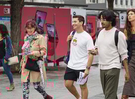 Three students walk the streets of Madrid