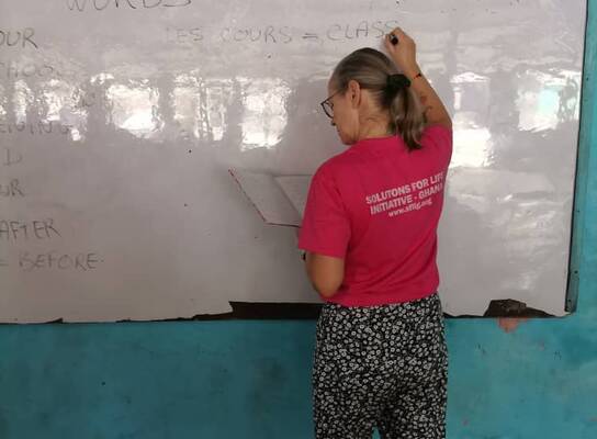 Sisi from France giving lessons to Junior High Students