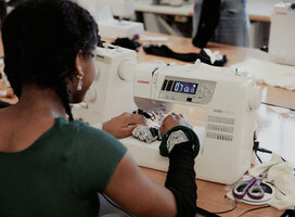 Student using sewing machine