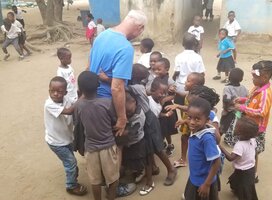 Dave surrounded by children from the refugee camp