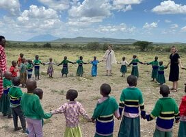 volunteer teachers playing with the students after a break from teaching 