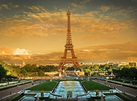 The Eiffel Tower glows in sunlight in front of the Trocadero