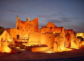 Illuminated 18th-century mud-brick architecture that served as original home of Saudi royal family and is now UNESCO World Heritage Site.
