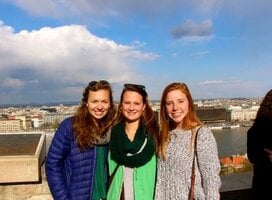 Students standing in front of the Seville skyline