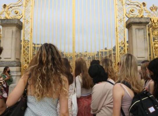 High school students in front of the gates of Versailles
