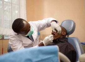 A dentist doing a dental check-up during Go-Elective Dental Internship in Kenya