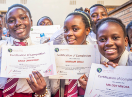 Young learners with their certificates