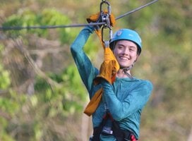 Student explore the rain forest via a zip line course in Belize