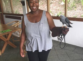 Student holding a raptor