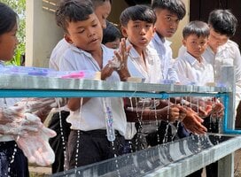 Students practising hand wash during a hygiene workshop